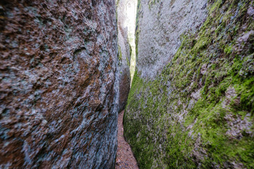 Klyvesten 14 m long granite boulder with a crack to walk through