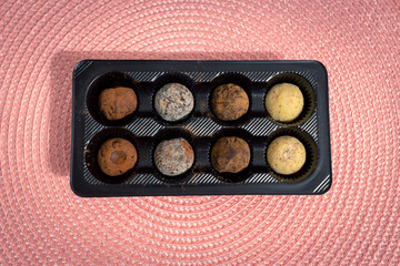 Delicious chocolate dessert. Round chocolate candies in a package