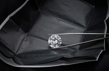 Round Diamond in Black Diamond Parcel with Tweezers