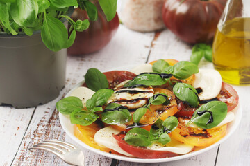 A plate with Italian salad caprese