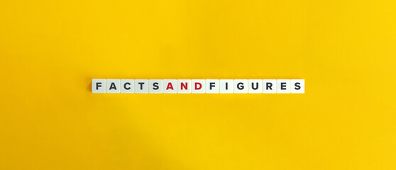 Facts and Figures Phrase on Letter Tiles on Yellow Background. Minimal Aesthetics.