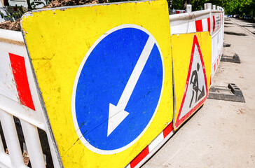 Road work and detour sign on the city road