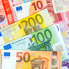 Euro banknotes close up as money background