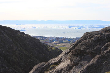 Fototapeta na wymiar Scenic view on Ilulissat with icebergs in Disko bay (horizontal), Ilulissat, Greenland