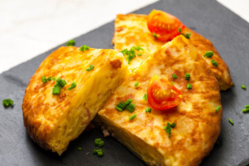 Spanish tortilla with tomatoes and chive