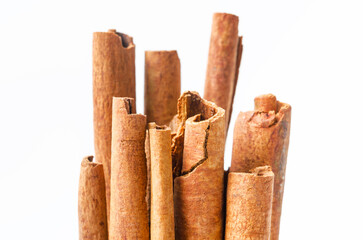 Group of cinnamon sticks on white background