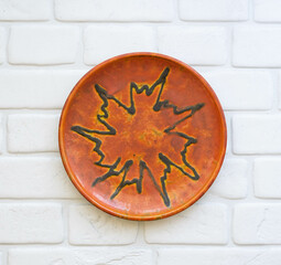 Mid-century modern pottery - orange wall plate