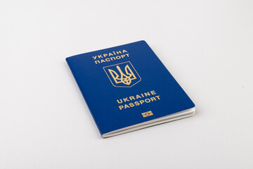 Ukrainian passport with a golden trident symbol on light background. Biometric Ukraine passport id empty place for photo or text.