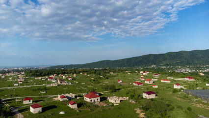 Top view from a drone on a village in summer