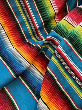 poncho serape Mexican background for Mexico cinco de mayo fiesta wooden copy space stripe pattern minimalist simple Mexican background backdrop - stock photo,