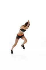 Studio shot of professional female athlete, runner training isolated on white background Concept of action, motion, speed. High angle view