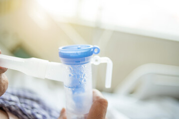 patient doing nebulization therapy background material