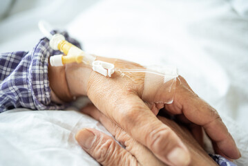 Fototapeta na wymiar Indwelling intravenous needle on the hand of a patient in hospital