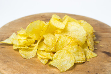 Potato chips on a white background. Delicious snack for beer and other drinks.