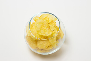 Potato chips on a white background. Delicious snack for beer and other drinks.