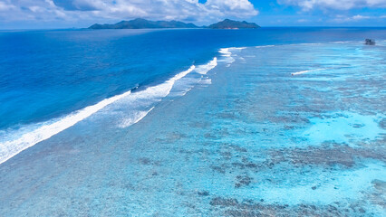 Coral Reef from drone. Seychelles beach and rocks on a sunny day