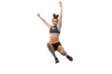 Long jump technique. Studio shot of professional female athlete in sports uniform jumping isolated on white background. Concept of sport, action, motion, speed.
