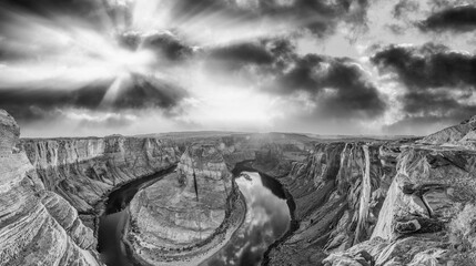 Horseshoe Bend panoramic aerial view, Arizona. Rocks and Colorado River at sunset in black and...
