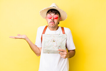 young hispanic tourist feeling puzzled and confused and doubting. holidays concept