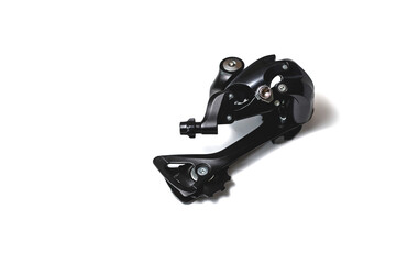 Black part, insulated on white background bicycle rear derailleur component, bicycle spare part