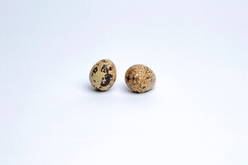Two boiled spotted quail egg isolated on white background. Healthy Food Products Concept

