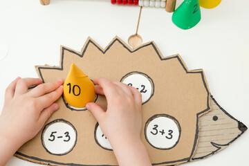 Hedgehog and numbers. Learning math. Calculation game for children. Early education. Montessori thematic tool for preschool children and people with special needs.