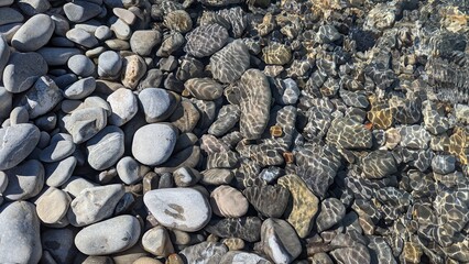 pile of pebbles on Nice beach, France, with waves