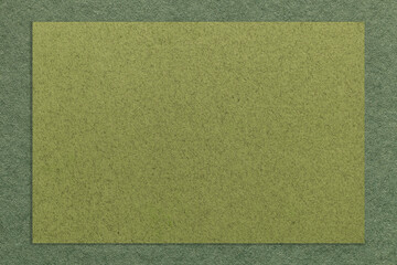 Fototapeta premium Texture of craft green paper background with dark olive border. Structure of vintage cardboard with empty frame.