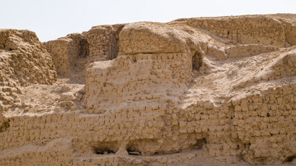 Fototapeta premium Ancient Adobe brick wall of structure in ruins, Lima Peru