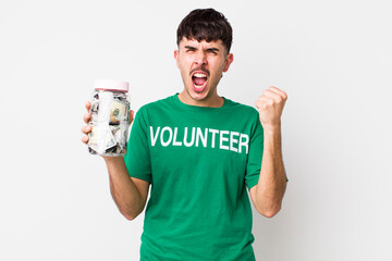 hispanic volunteer shouting aggressively with an angry expression. donations concept