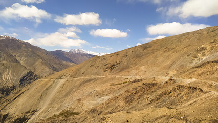 Amazing landscape with Spiti valley, blue sky with clouds  in India. Mountain valley. Travel in Himachal Pradesh. Nature