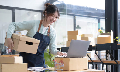 Starting small businesses SME owners female entrepreneurs check online orders to prepare to pack the boxes, sell to customers, sme business ideas online.