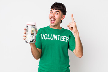 hispanic volunteer feeling like a happy and excited genius after realizing an idea. donations...