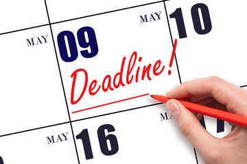 Hand drawing red line and writing the text Deadline on calendar date May 9. Deadline word written...