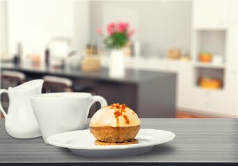 Tasty homemade chocolate cake on the plate on the desk