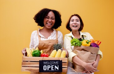 Portrait smiling happy Partner African woman Agricultural business owner holding wooden basket fruit vegetable.The opening of an American business woman's Delivery Organic food  shop.Brazilian female.