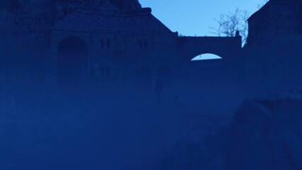 Man in hoodie walks on a bridge of an ancient misty castle at dusk. 3D render.