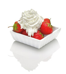 strawberries and whipped cream on a white background - 507853455