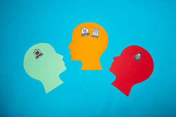 blue head from icon hacker and red head from icon detective looking at orange head with data, hacker attack and data protection on internet and computer