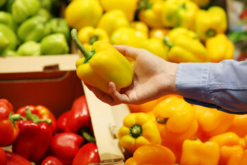 buying peppers at the market