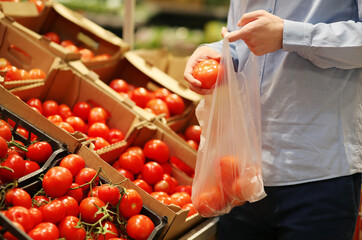 buying tomatoes at the market