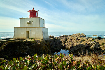 Fototapeta na wymiar Vancouver Island Amphitrite Point Lighthouse. Amphitrite Point Lighthouse on a rocky headland overlooking the Pacific Ocean. Ucluelet, Vancouver Island, BC