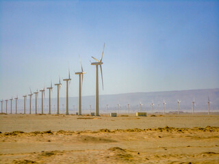 Landscape desert, blue sky, many windmills. wind farm. Copy spase