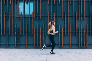 Girl with ponytail running, jogging, jumping.