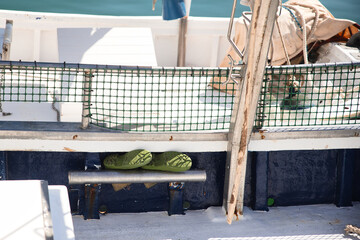 interior of fishing boat with wellies