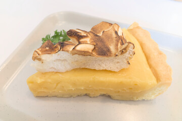 Abstract photo of Lemon meringue pie is a type of dessert pie, consisting of a shortened pastry base filled with lemon curd with toasty meringue topping has balanced flavour between sweet and sour.