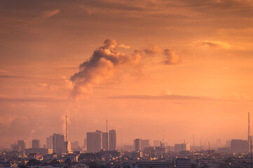 Sunrise over high rise building in business district at Bangkok city