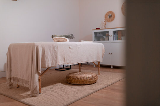 Empty Massage Room With A Quiet Atmosphere And Tone, Ready To Receive The Clients That Seek For Their Wellness