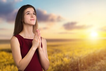 The person prays at sunset. The believer prays. Prayer to God for peace in Ukraine. Prayer process.