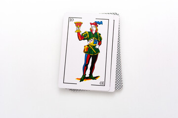 Spanish card game, spanish deck Tarot cards, the cups card in the foreground.